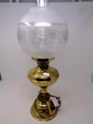 A brass oil lamp with chimney and shade (electrified)