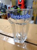 A box containing twenty four Hoegaarden half pint glasses