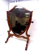 A mahogany shield shaped dressing table mirror