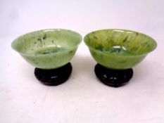 Two Chinese jade bowls on wooden stands, diameter 12.