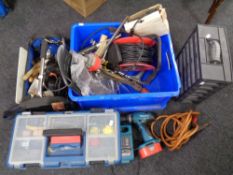 A tool bag and a tool box containing a large quantity of hand tools, hardware,