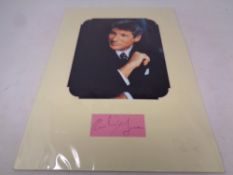 A mounted Richard Gere autograph with photo