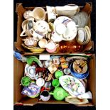 Two boxes containing assorted ceramics to include sugar basins and milk jugs, glassware,