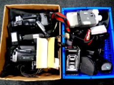 Two boxes containing assorted camera accessories, cine cameras,