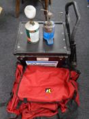 A Shakespeare fishing box with fishing bag, camping stove,