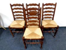 A set of four rush seated farmhouse ladder back chairs