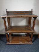 A 19th century oak three tier dumb waiter