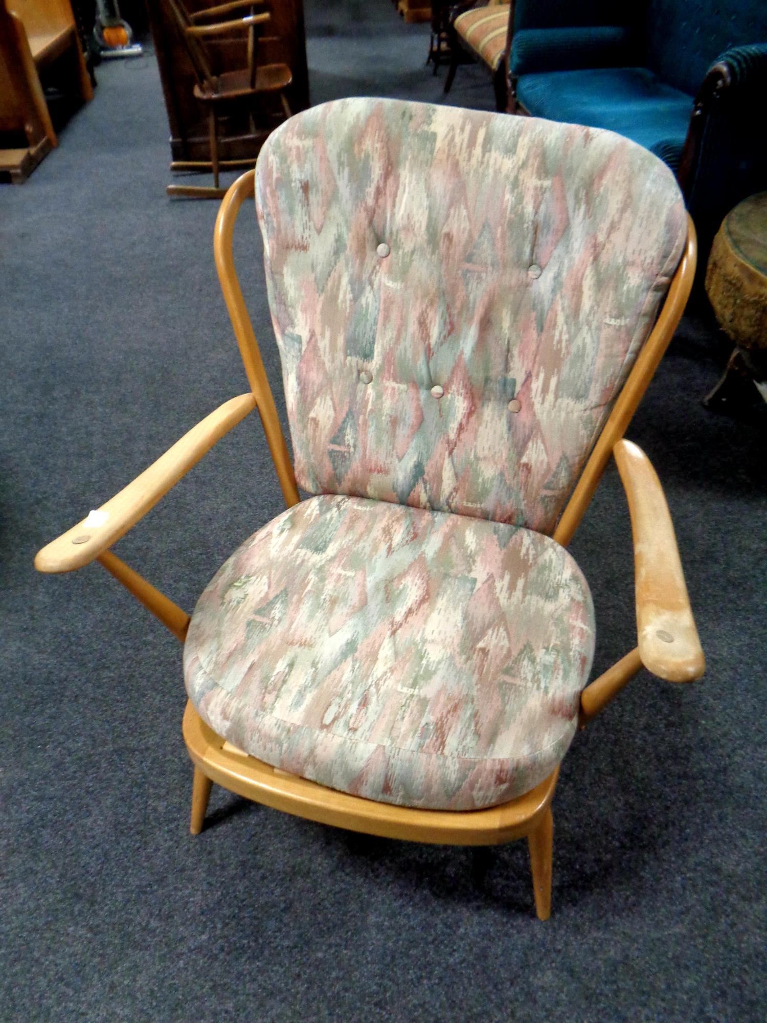 An Ercol solid elm and beech armchair