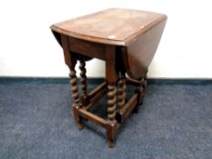 An Edwardian oak gate leg table,