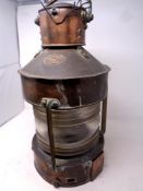 A copper ship's lamp by Telford,