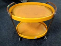A 20th century tubular metal and plastic two tier trolley
