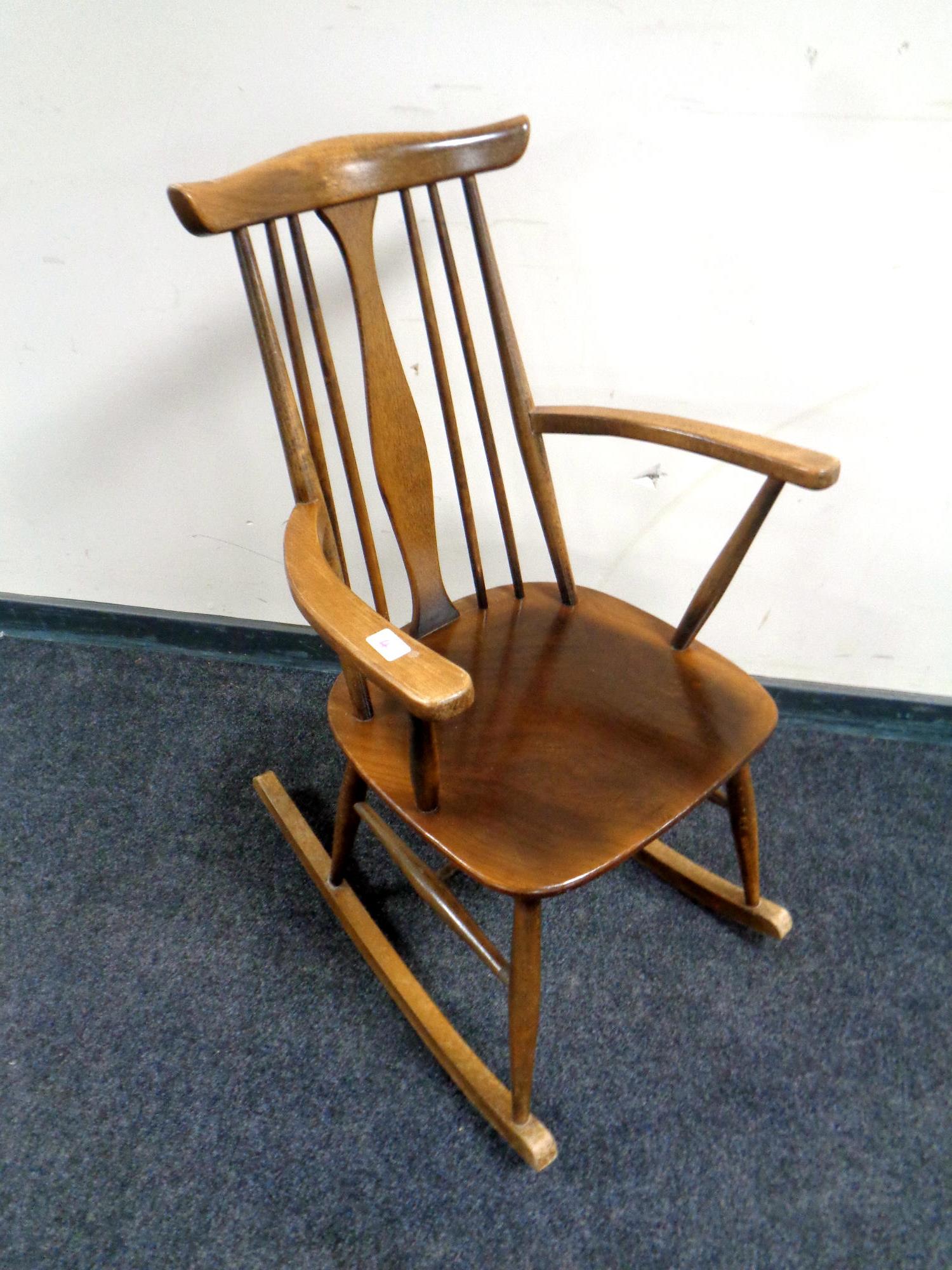 An Ercol solid elm and beech rocking chair