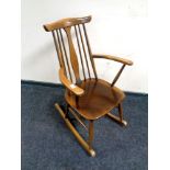 An Ercol solid elm and beech rocking chair