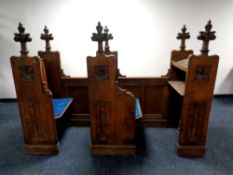 A 19th century heavily carved oak twin-section prayer stall,