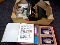 A box containing six albums and folders of world stamps,
