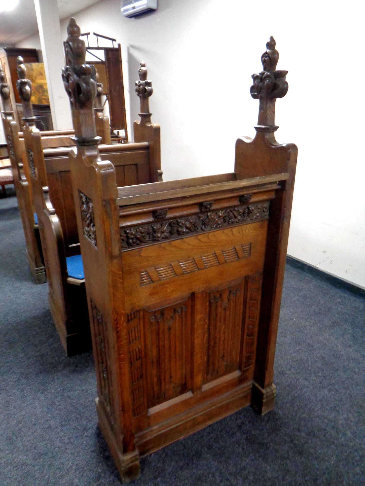 A 19th century heavily carved oak twin-section prayer stall, - Image 2 of 6