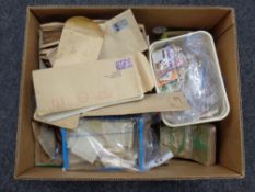 A box containing a large quantity of 20th century world stamps in envelopes