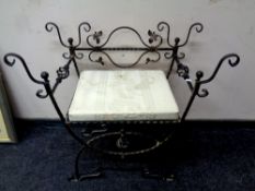 A contemporary wrought iron dressing table chair
