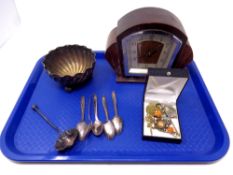 A tray containing plated bowl, tea strainer and spoons,