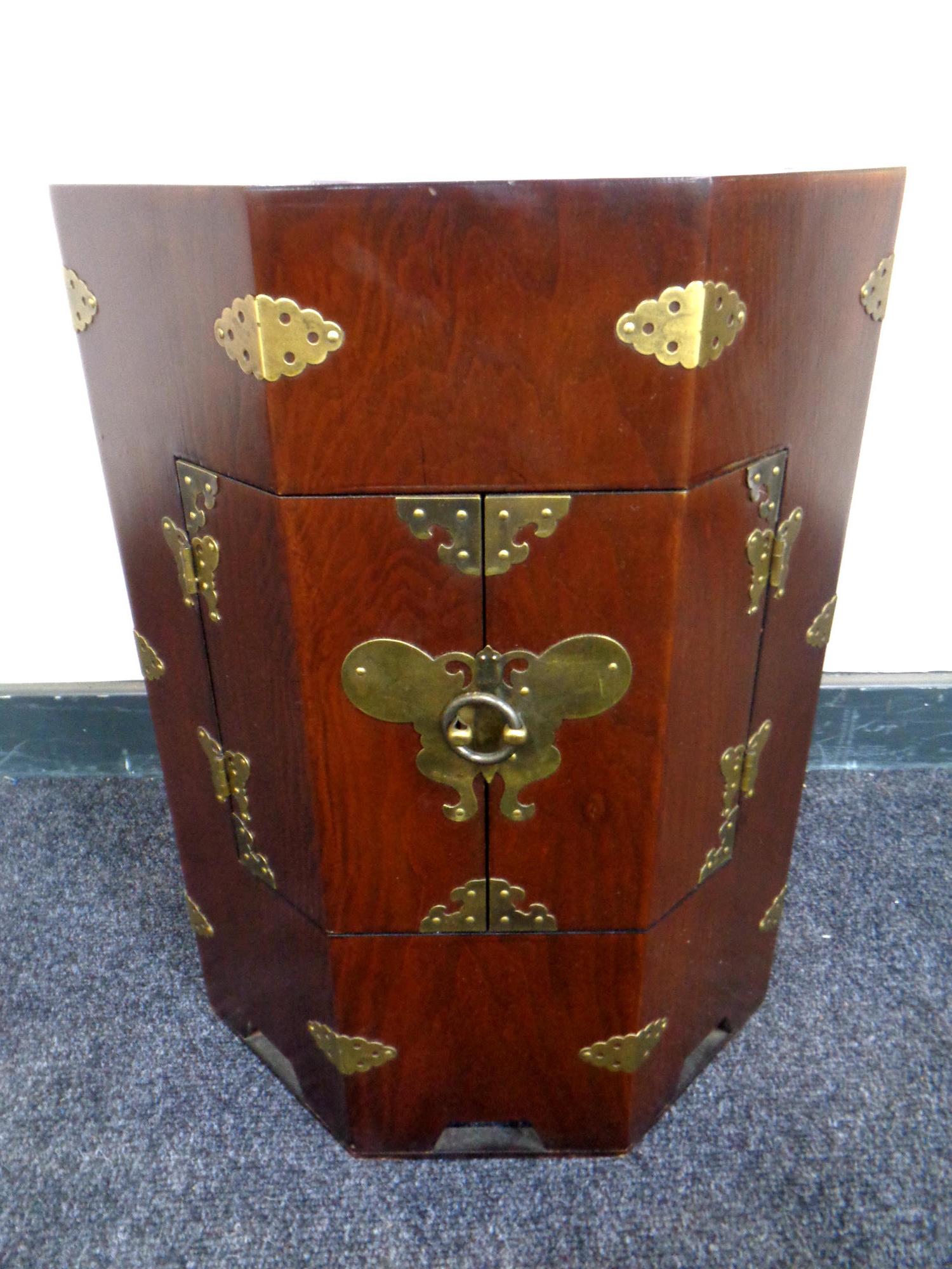 A Chinese style hexagonal double door low cabinet