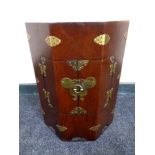 A Chinese style hexagonal double door low cabinet