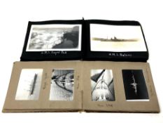 Two albums containing antique photographs of ships and landscapes