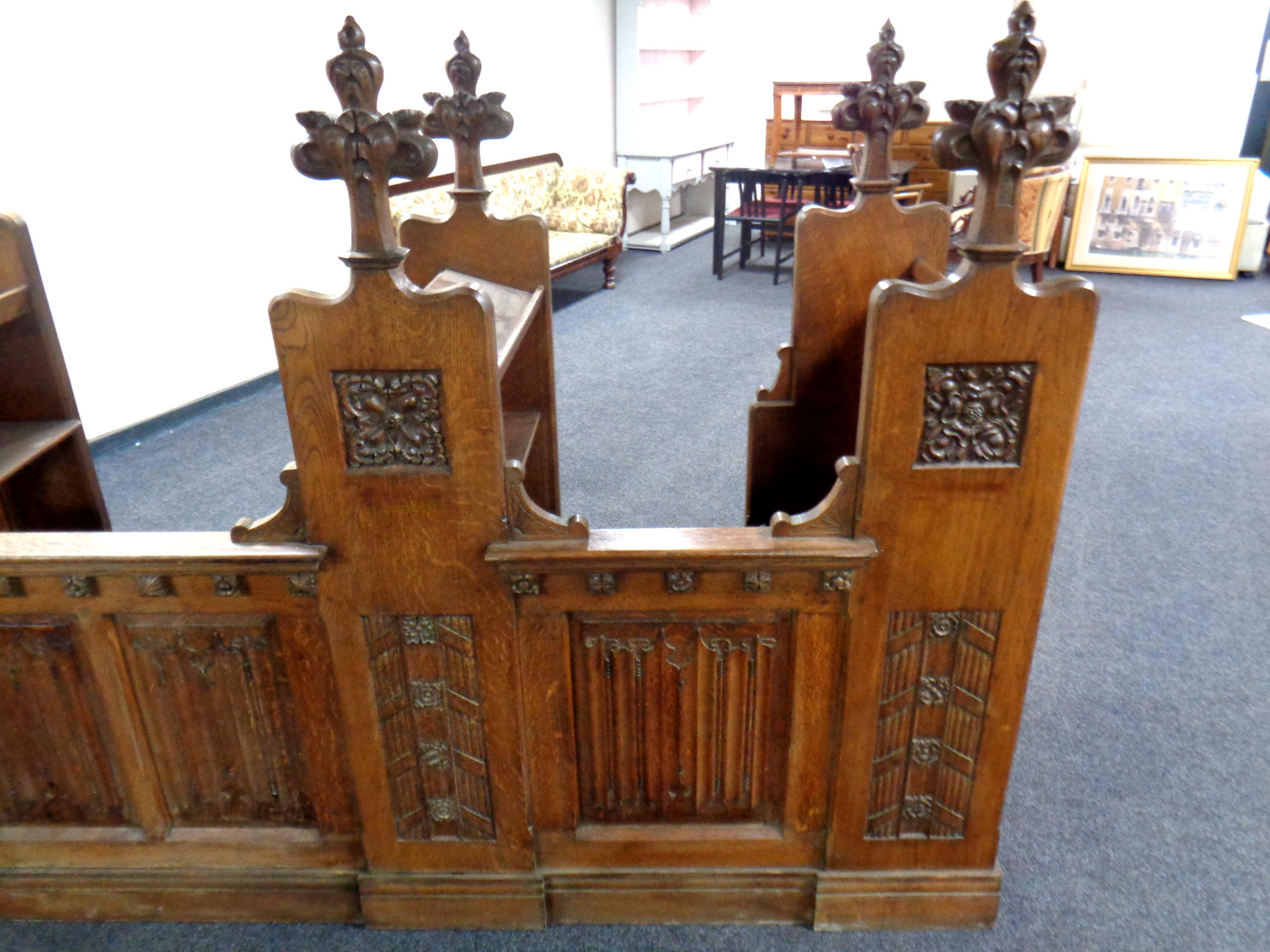 A 19th century heavily carved oak twin-section prayer stall, - Image 6 of 6