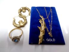 A collection of gold jewellery including dolphin brooch, ring,