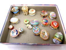 A box containing sixteen Halcyon enamel trinket boxes and eggs