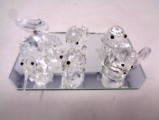 Six miniature Swarovski crystal animal ornaments on mirrored stand