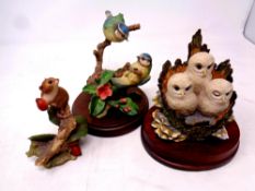 A Border Fine Arts figure, three owl babies on wooden stand,