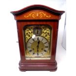 An early 20th century mahogany cased bracket clock with decorative brass dial,
