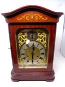 An early 20th century mahogany cased bracket clock with decorative brass dial,