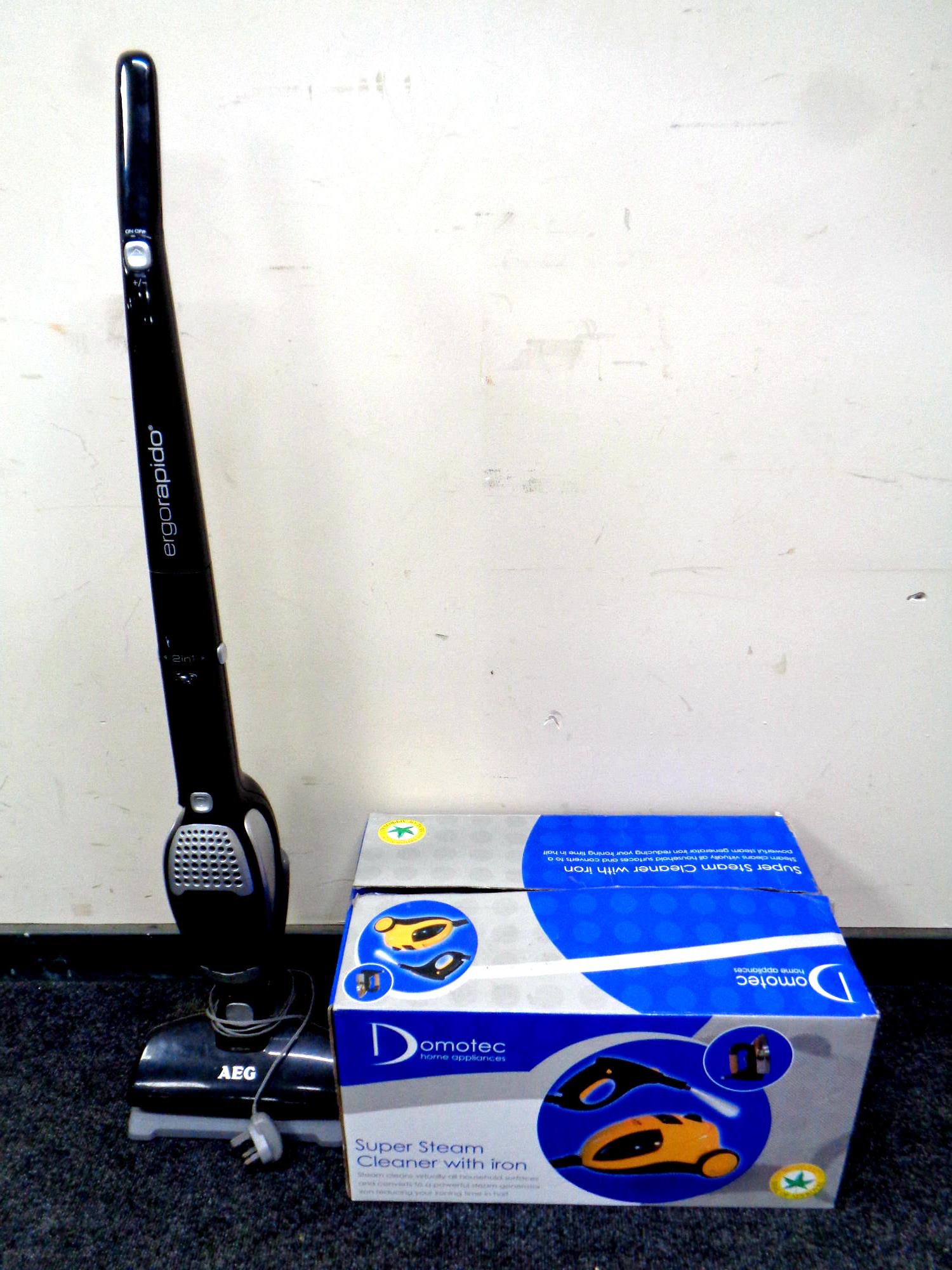 A Domotec steam cleaner with iron, boxed,