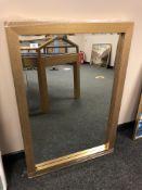 A contemporary gold effect bevelled mirror,