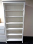 A set of Ikea painted pine open bookshelves,