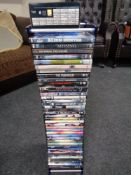 A DVD rack containing DVDs - James Bond etc