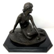 After Peter Breuer : bronze figure of a lady seated, height 29 cm, on marble plinth.