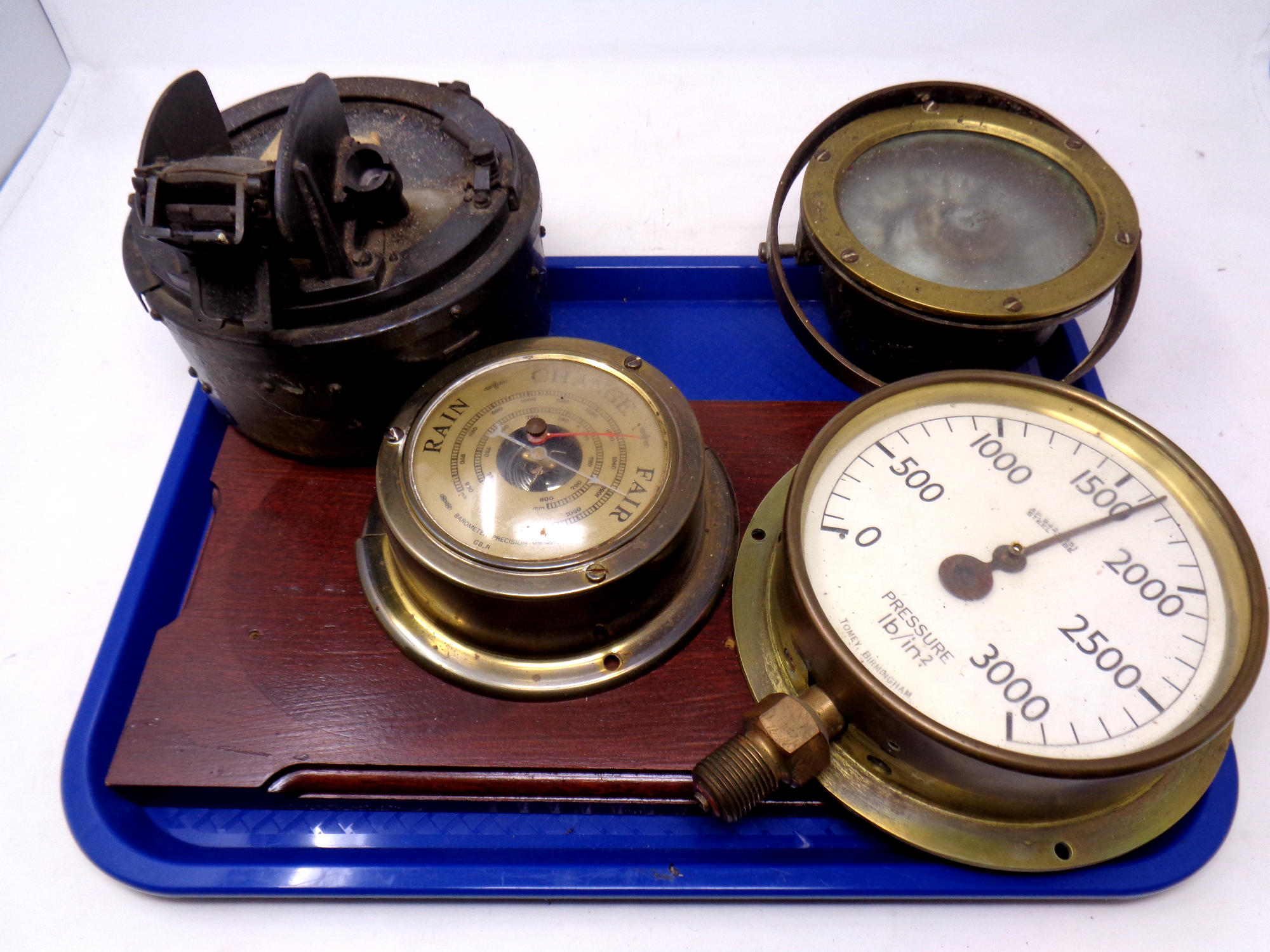 Two vintage ship's compasses together with a brass cased pressure gauge and a brass cased barometer