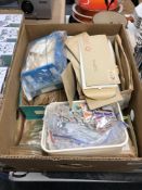 A box containing a large quantity of world stamps in envelopes