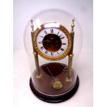 A gilt metal J W Benson eight day skeleton clock on stand under glass dome