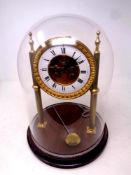 A gilt metal J W Benson eight day skeleton clock on stand under glass dome