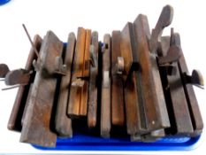 A tray containing a quantity of vintage moulding planes