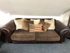 A Tetrad leather and fabric settee with scatter cushions