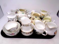 A tray containing a quantity of porcelain milk jugs including Duchess, Paragon,