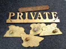 A box containing assorted metal ware to include two signs,