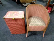 A pink loom armchair and a glass topped linen box