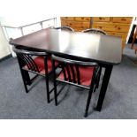 A 20th century black ash extending dining table and four black ash Bentwood chairs