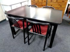 A 20th century black ash extending dining table and four black ash Bentwood chairs