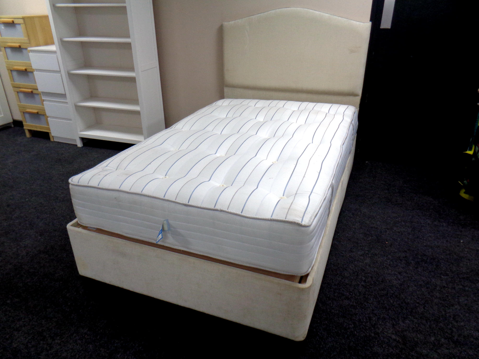 A 4' electric divan and interior with padded headboard